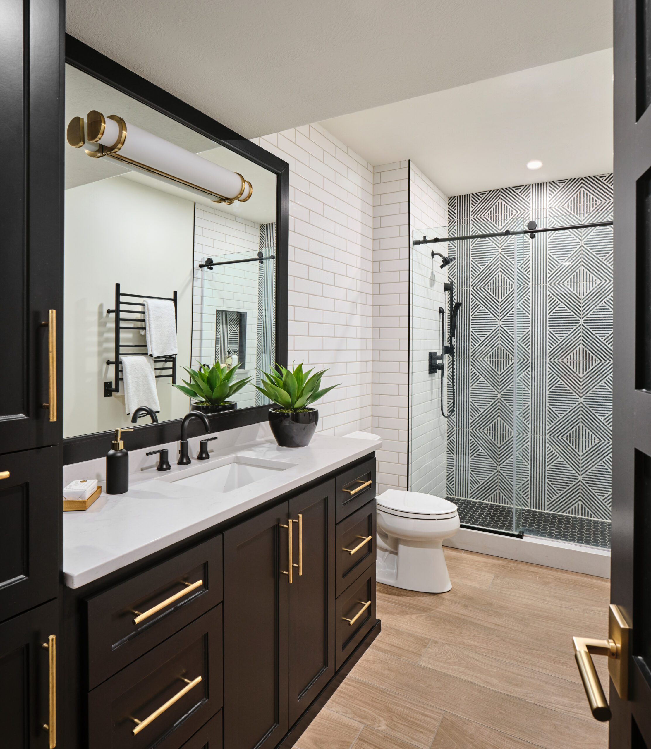 Omaha Interior Designer, Haven Design and Construction,San Antonio Builder,San Antonio Interior Designer,masculine bathroom, black cabinets, white oak floor, bathroom tile ideas
