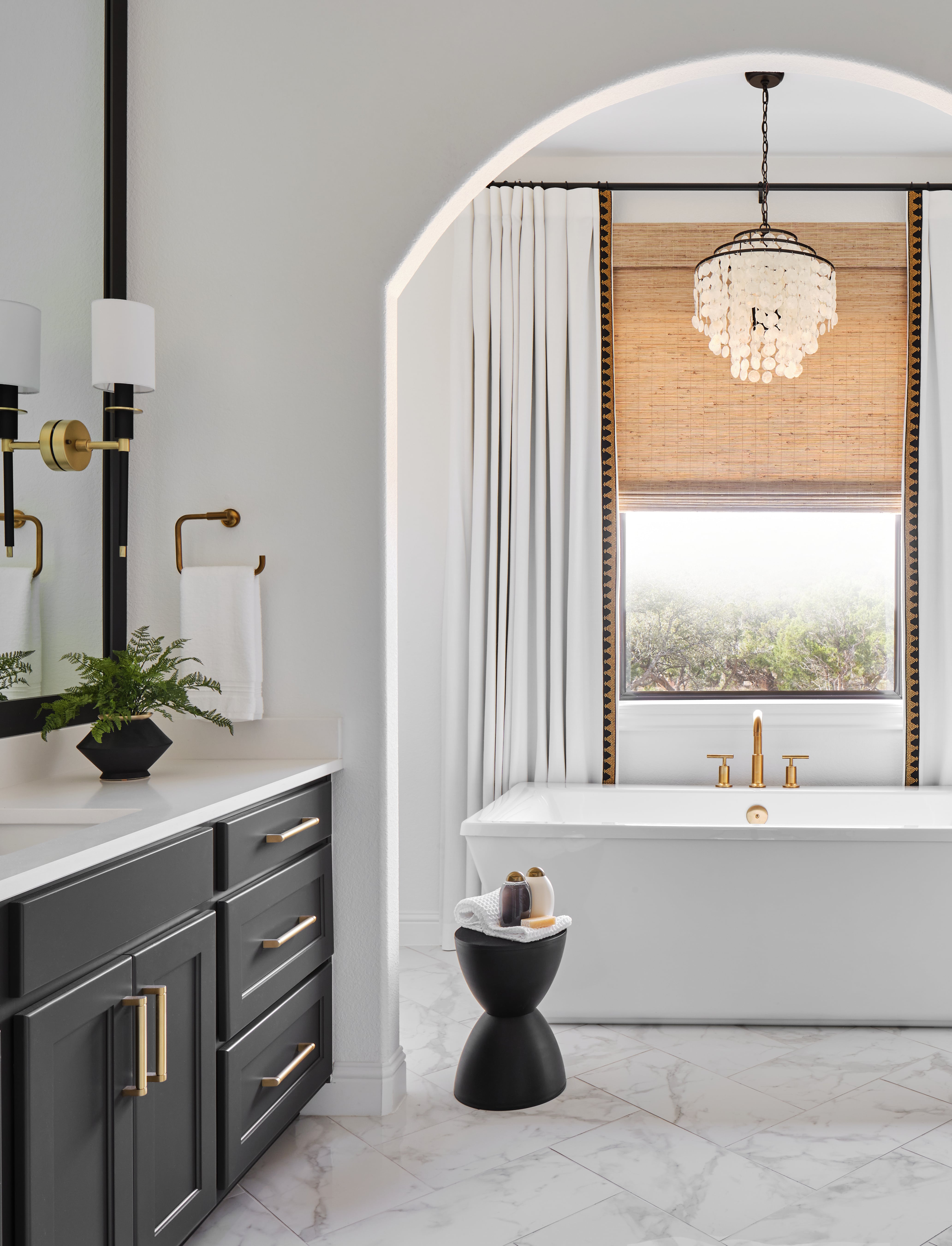 DBelterra Austin Dripping Spings TX Austin Interior Designer Haven Design and Construction Master Bathroom free standing tup Primary bathroom tub chandelier min
